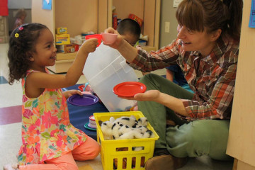 A child and educator learning through play